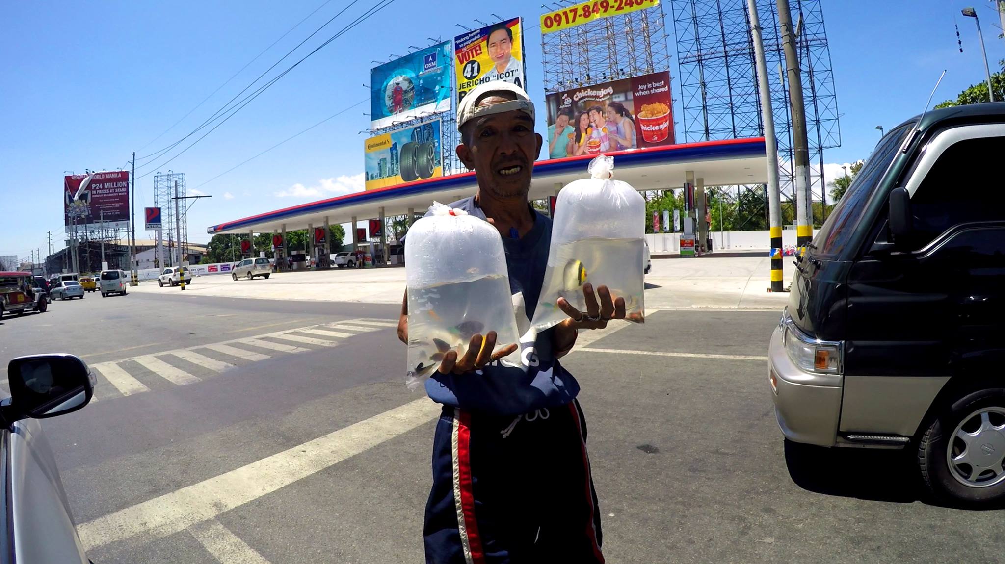 Manila guy on the highway is trying to sell me... tropical fish?