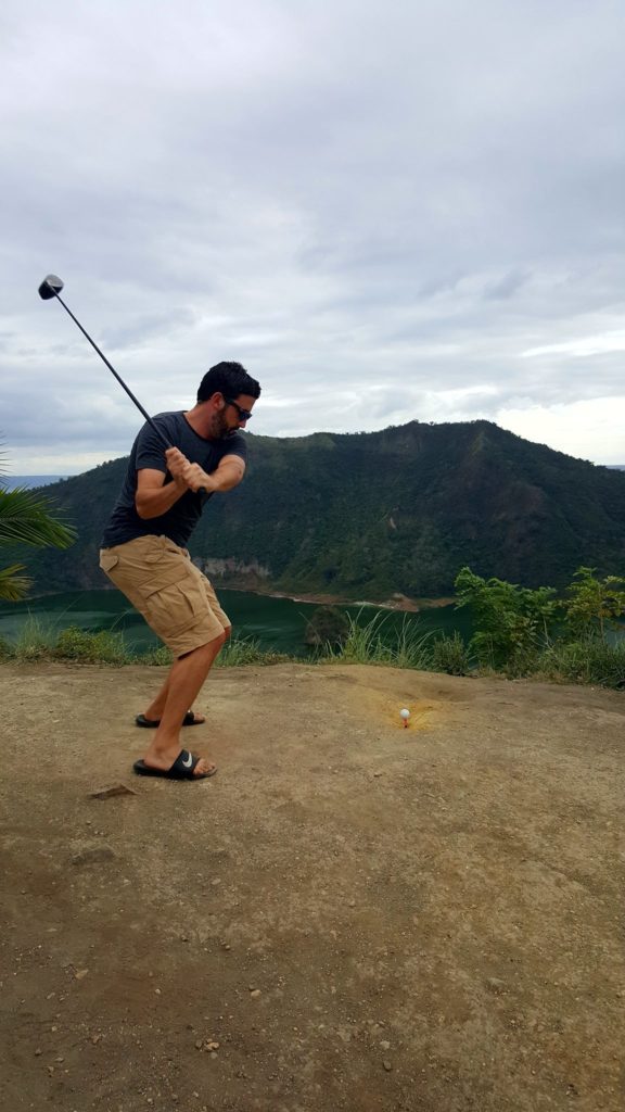 Hitting a golfball into Taal Volcano