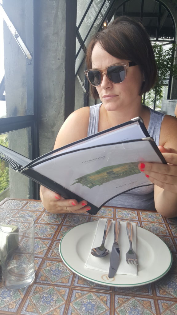 Louise Connolly deciding what to eat in the Philippines