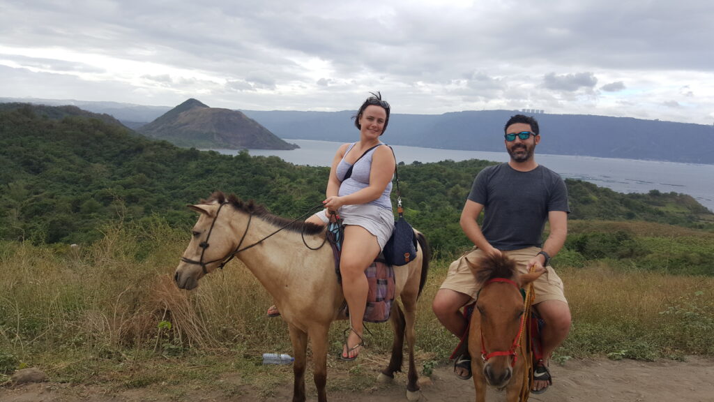 Louise Connolly and Michael Doig riding to the top of Taal Volcano, Philippines